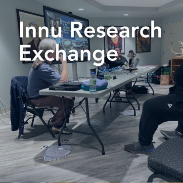 A photo of two men working in an office, with the words Innu Research Exchange written on top